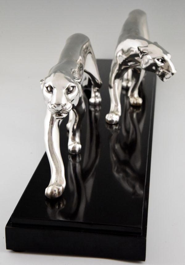 Art Deco silvered sculpture of two panthers.