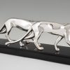 Art Deco silvered sculpture of two panthers.