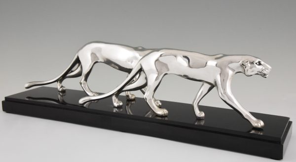 Art Deco silvered sculpture of two panthers.