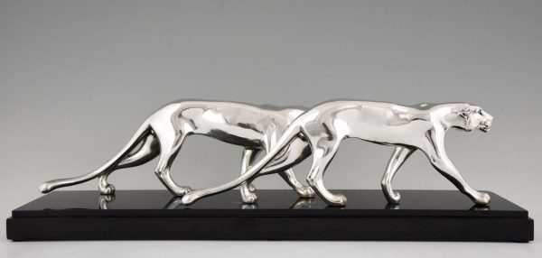 Art Deco silvered sculpture of two panthers.