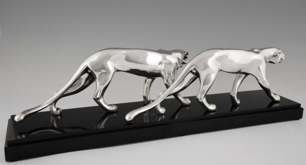 Art Deco silvered sculpture of two panthers.