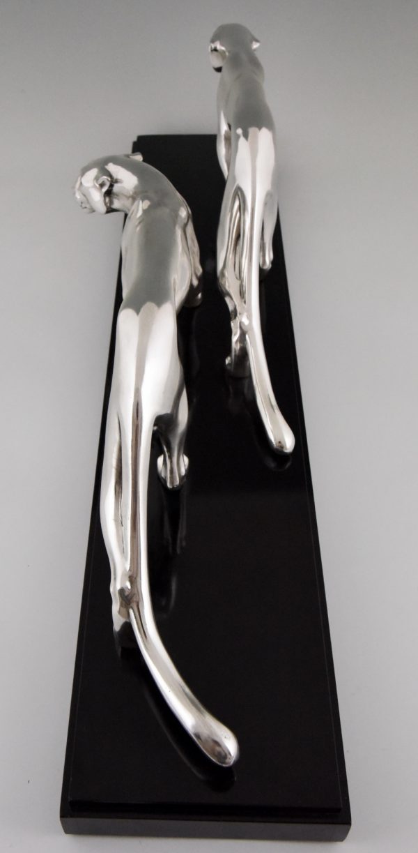 Art Deco silvered sculpture of two panthers.