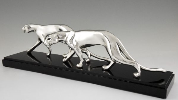 Art Deco silvered sculpture of two panthers.