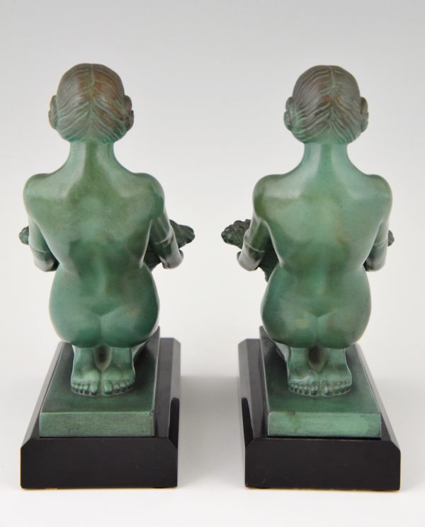 Art Deco bookends kneeling nudes with baskets.