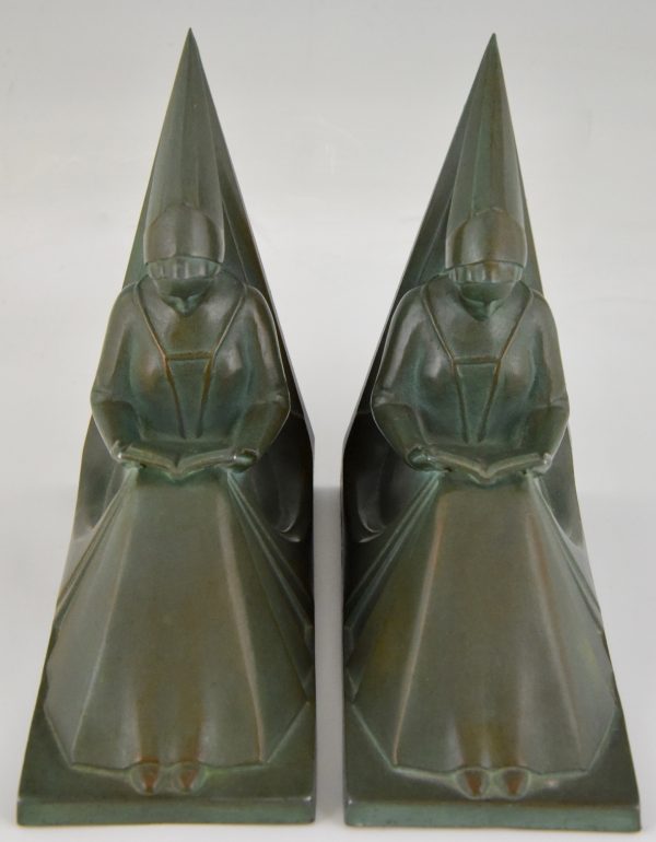 Art Deco bookends reading Medieval ladies