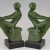 Art Deco bookends reading nudes