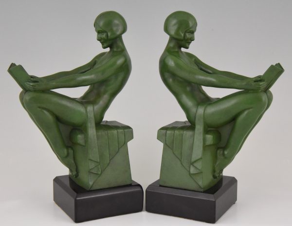 Art Deco bookends reading nudes