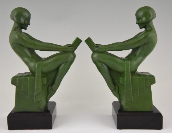 Art Deco bookends reading nudes