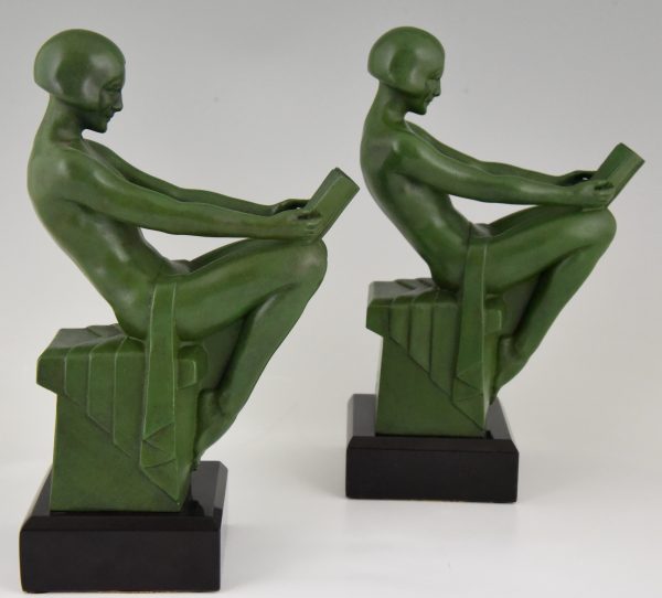 Art Deco bookends reading nudes