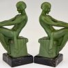 Art Deco bookends reading nudes