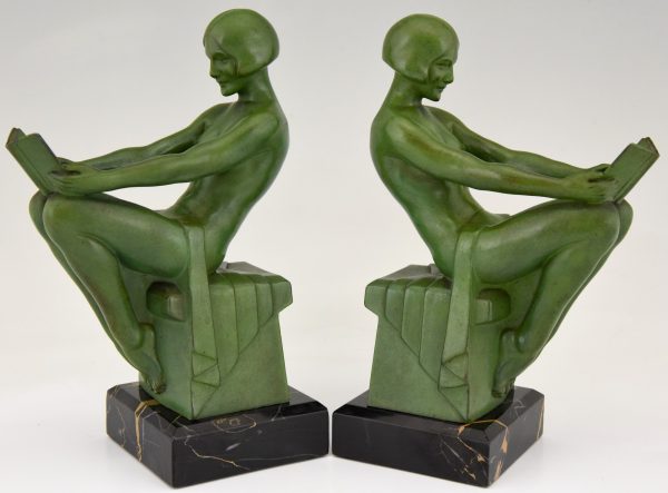 Art Deco bookends reading nudes