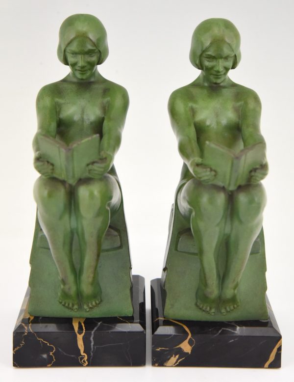 Art Deco bookends reading nudes