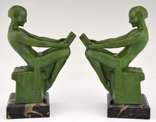 Art Deco bookends reading nudes