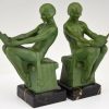 Art Deco bookends reading nudes