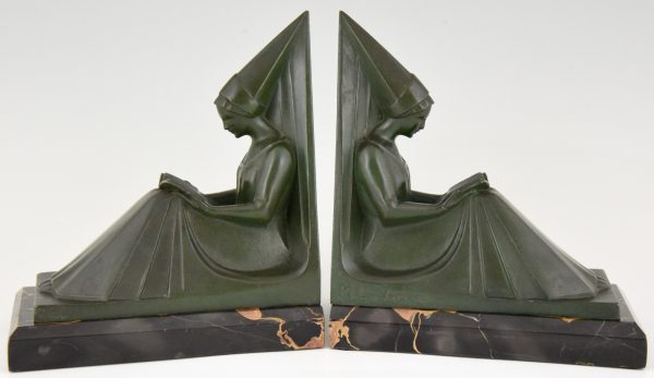 Art Deco figural bookends reading Medieval ladies