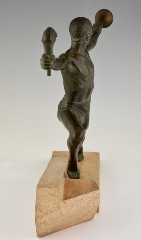 Art Deco sculpture male nude with trumpet and torch