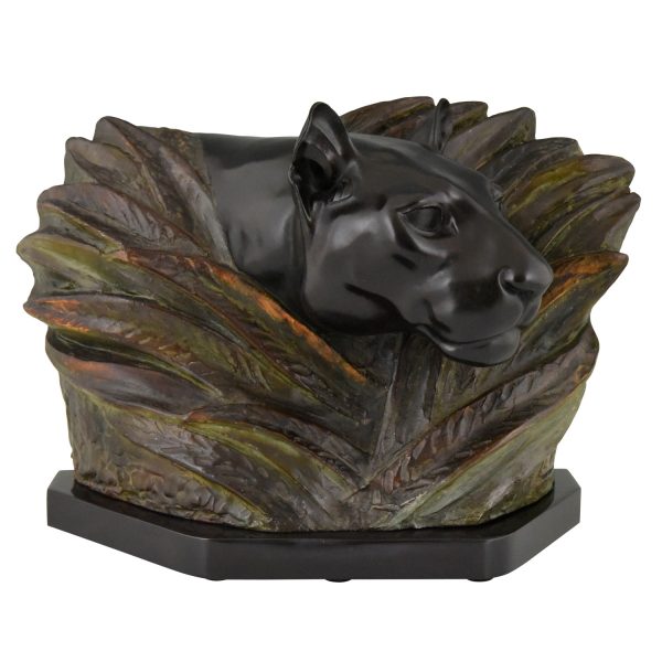 Art Deco sculpture of a panther head between bushes