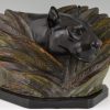 Art Deco sculpture of a panther head between bushes