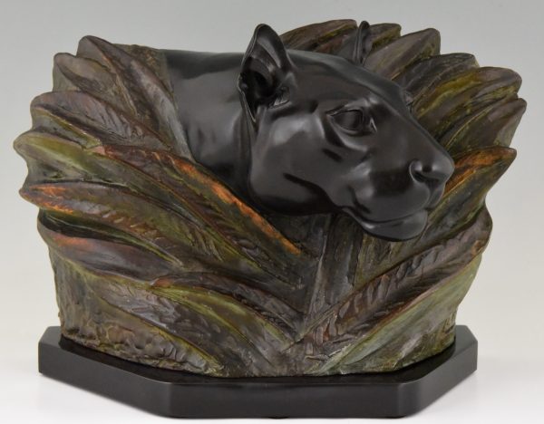 Art Deco sculpture of a panther head between bushes