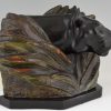 Art Deco sculpture of a panther head between bushes