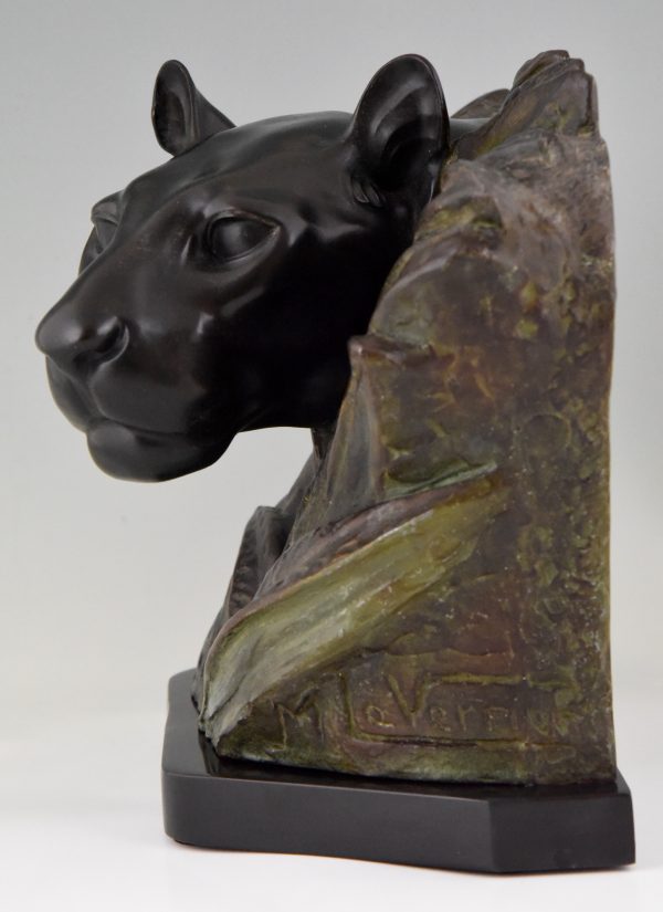 Art Deco sculpture of a panther head between bushes