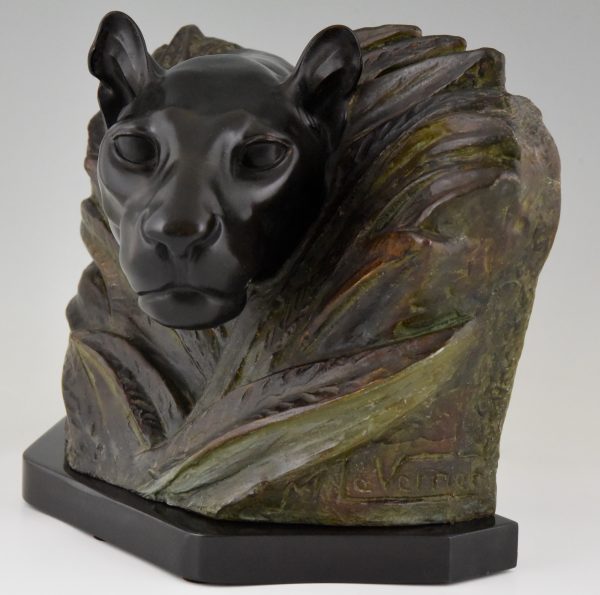 Art Deco sculpture of a panther head between bushes