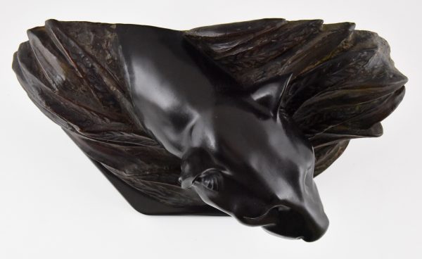 Art Deco sculpture of a panther head between bushes