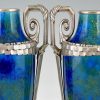 Pair Art Deco blue ceramic and bronze vases