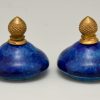 Paar blauwe vazen in keramiek en brons
