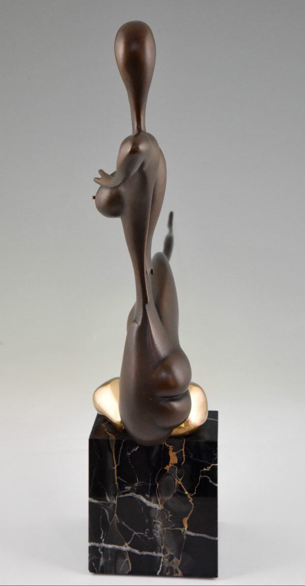 Modern bronze sculpture of a nude.