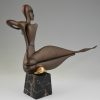 Modern bronze sculpture of a nude.