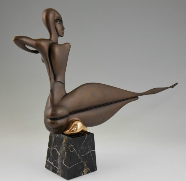 Modern bronze sculpture of a nude.