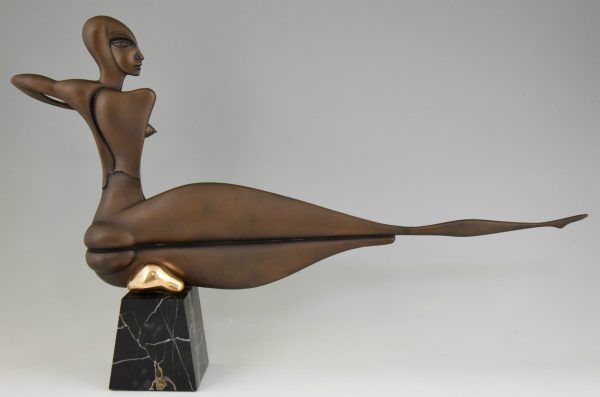 Modern bronze sculpture of a nude.