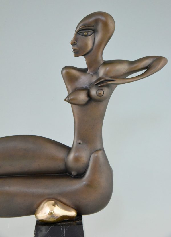 Modern bronze sculpture of a nude.