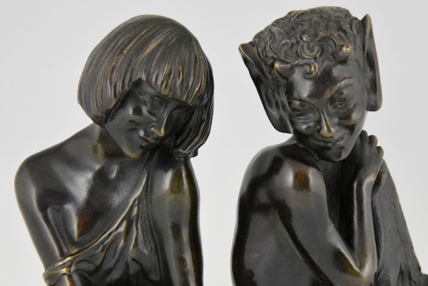 Art Deco bronzen boekensteunen sater faun en nimf