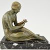 Art Deco bronzen boekensteunen man en vrouw met brief.