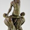 Art Deco sculpture of 3 athletes, male nudes.