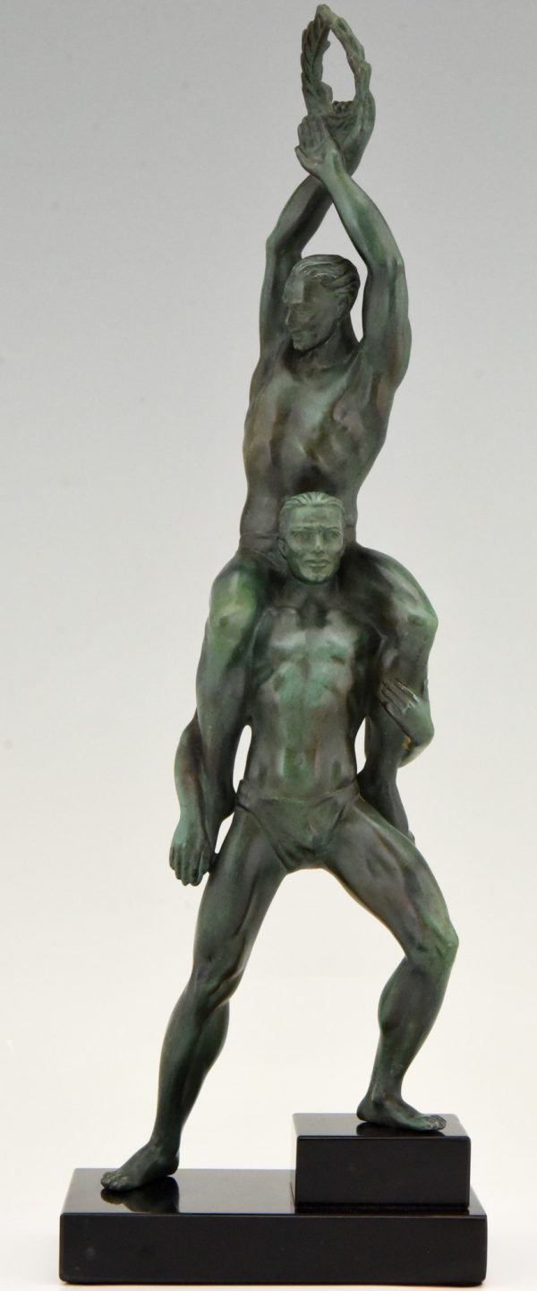 Art Deco sculpture of two athletes with laurel wreath