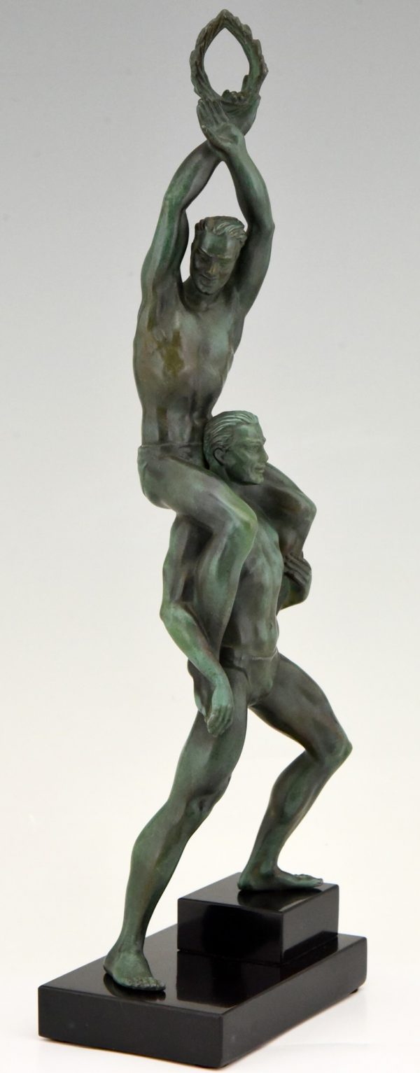 Art Deco sculpture of two athletes with laurel wreath