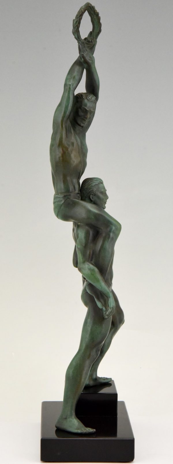 Art Deco sculpture of two athletes with laurel wreath