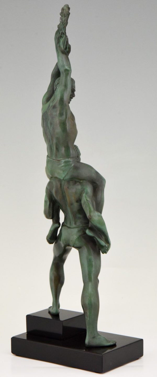 Art Deco sculpture of two athletes with laurel wreath