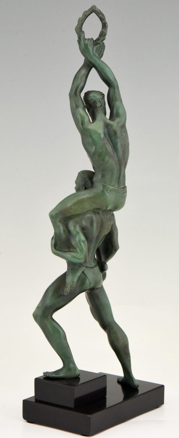 Art Deco sculpture of two athletes with laurel wreath