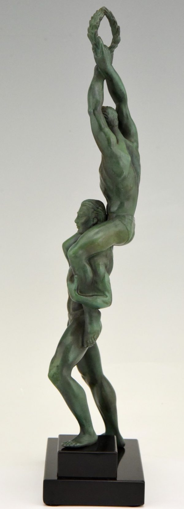 Art Deco sculpture of two athletes with laurel wreath