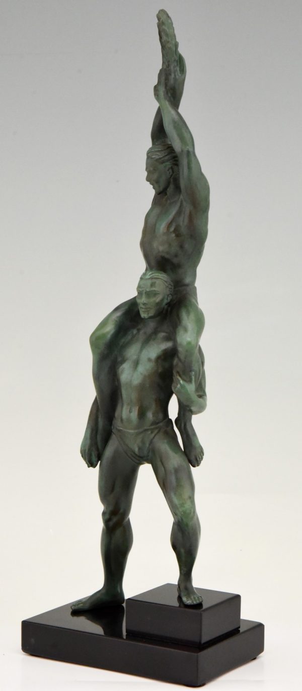 Art Deco sculpture of two athletes with laurel wreath