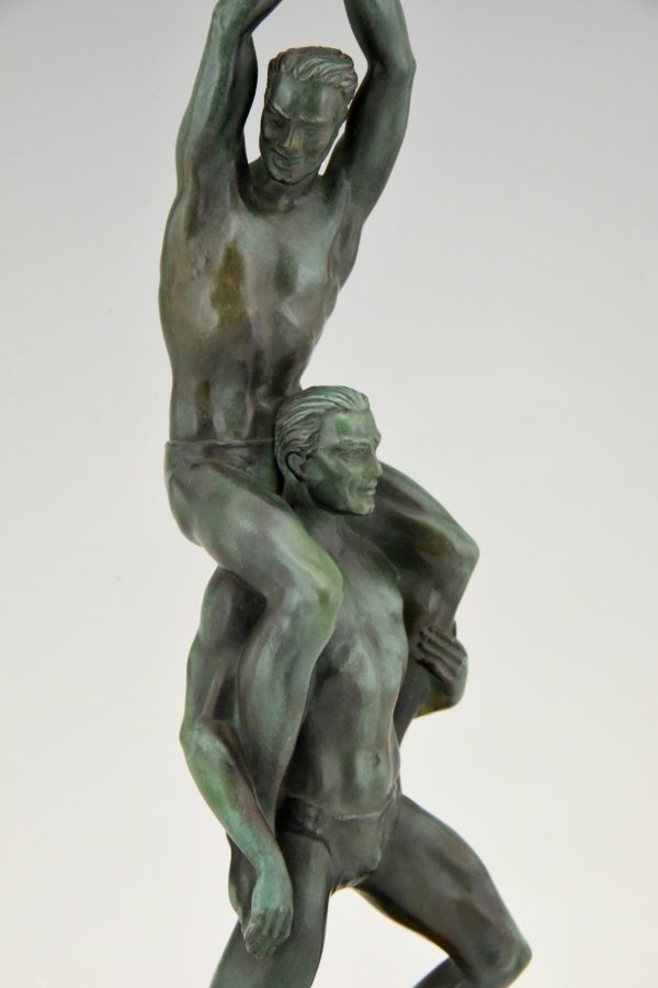 Art Deco sculpture of two athletes with laurel wreath