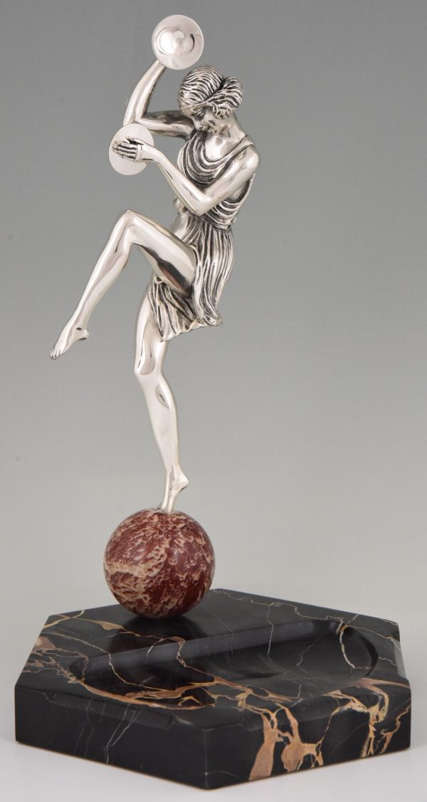 Art Deco silvered bronze cymbal dancer on marble tray