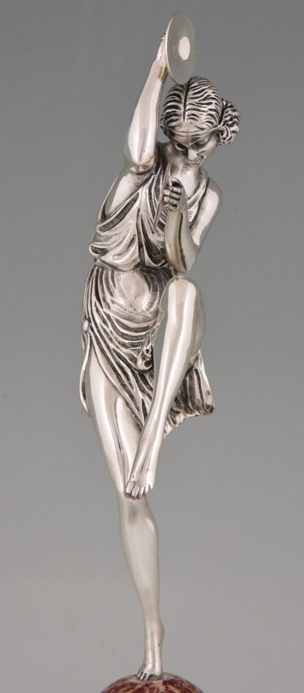 Art Deco silvered bronze cymbal dancer on marble tray