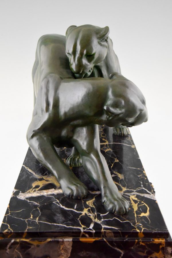 French Art Deco sculpture of two panthers.