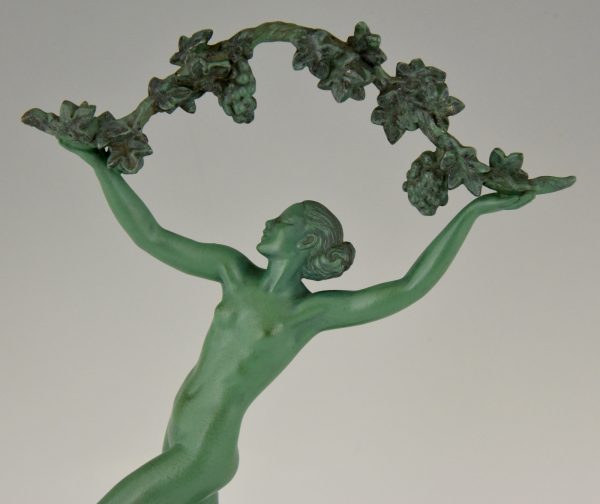 Art Deco sculpture of a nude with grapes