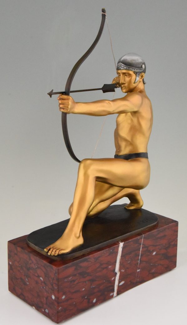 Antique bronze sculpture of a male nude archer.